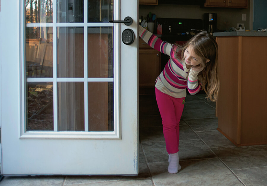 Girl holding door having hafele digital lock